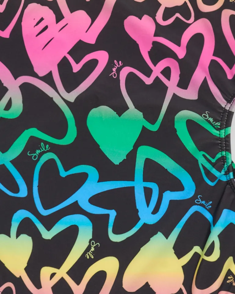 Bañador para niña en negro con corazones estampados y abertura lateral