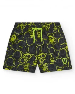 Bañador para niño en negro con estampado de emoticonos y cordón flúor.