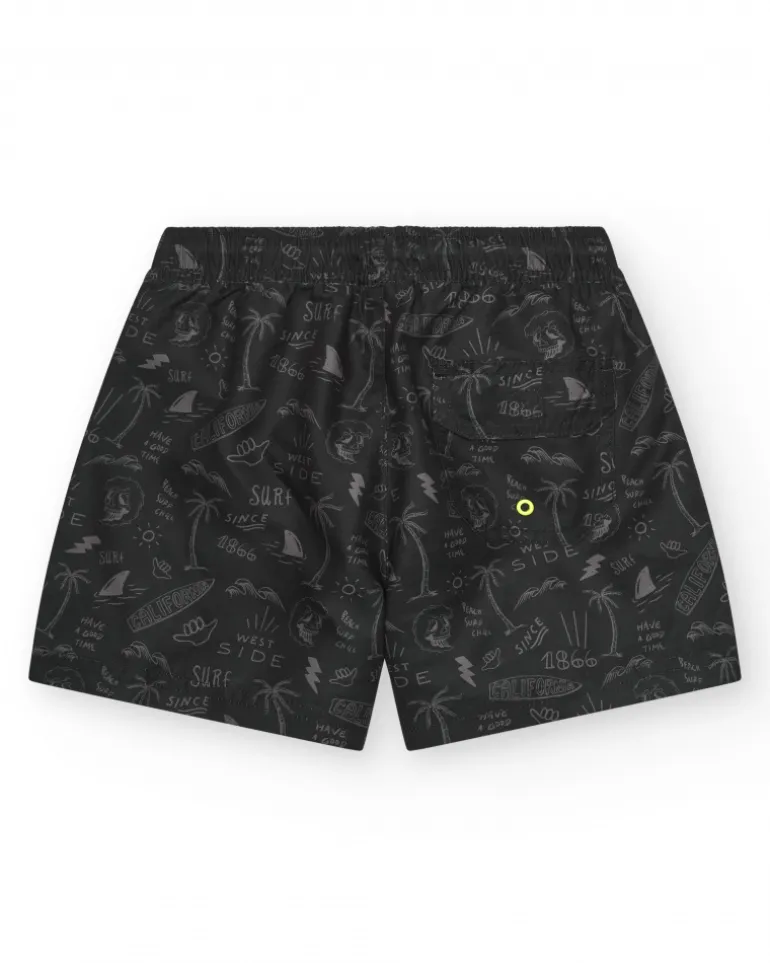 Bañador para niño en negro con estampado surfero y cordón flúor.