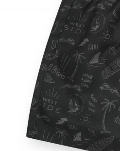 Bañador para niño en negro con estampado surfero y cordón flúor.