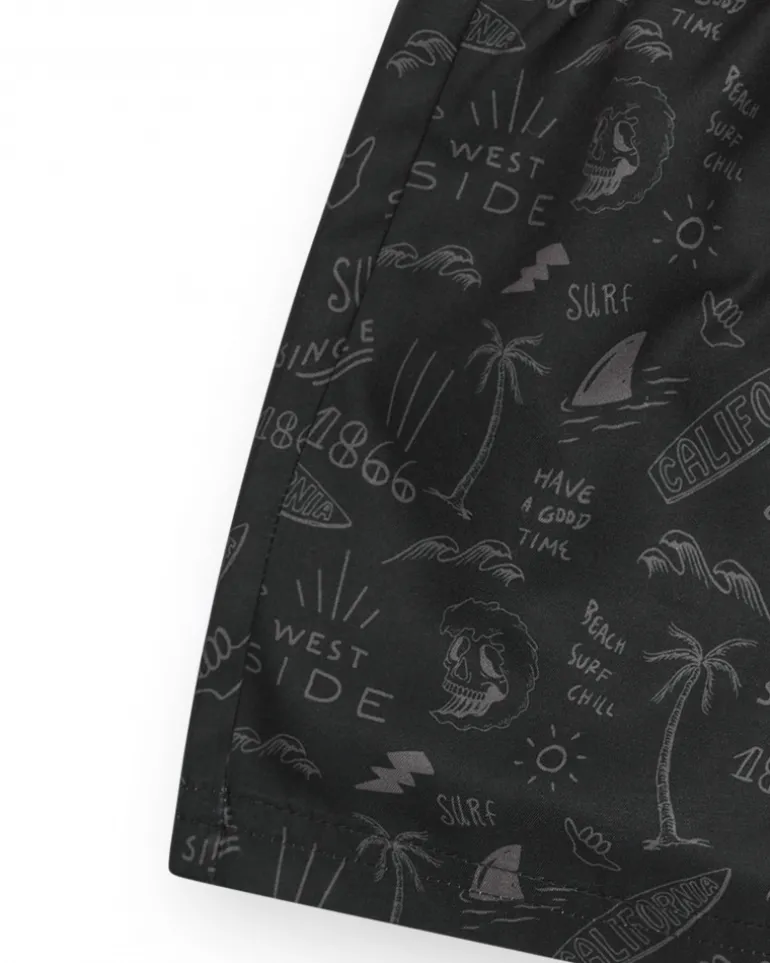 Bañador para niño en negro con estampado surfero y cordón flúor.