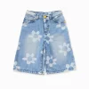 Bermuda niña en denim azul con estampado de flores