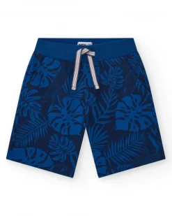 Bermuda para niño en negro con estampado tropical y cintura ajustable.