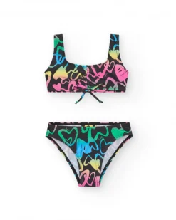 Bikini para niña en negro con corazones estampados y lazo decorativo