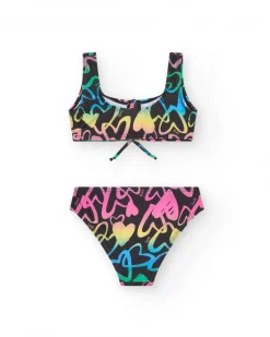 Bikini para niña en negro con corazones estampados y lazo decorativo