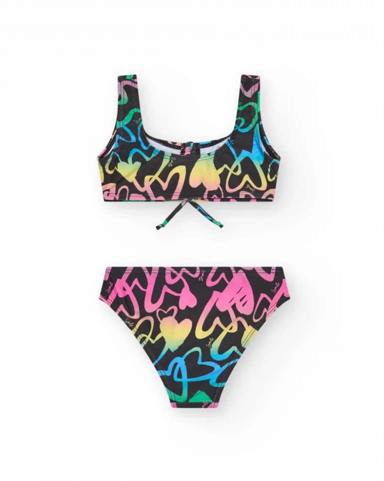 Bikini para niña en negro con corazones estampados y lazo decorativo