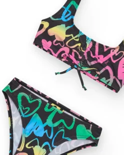 Bikini para niña en negro con corazones estampados y lazo decorativo