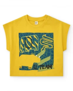 Camiseta amarilla para niño con estampado de dinosaurios y cierre en el hombro