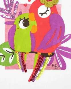 Camiseta blanca para niña con loros bordados y lentejuelas