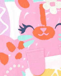 Camiseta blanca para niña con estampado tropical y cierre trasero