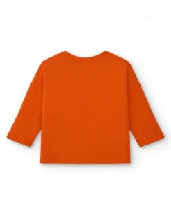 Camiseta de niña en naranja con estampado floral y texto colección Super Natural