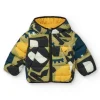 Chaqueta acolchada verde para niño con estampado de dinosaurios y forro amarillo
