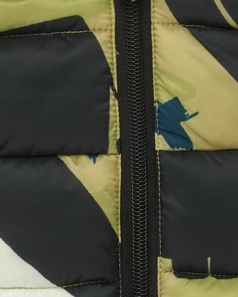 Chaqueta acolchada verde para niño con estampado de dinosaurios y forro amarillo