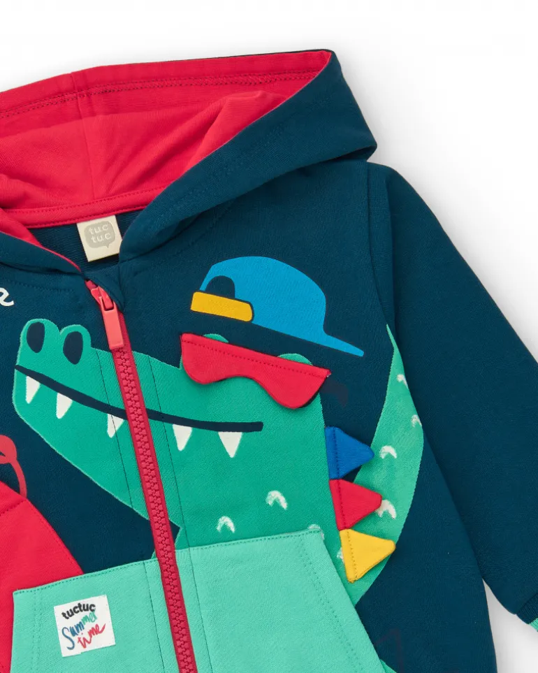 Chaqueta de felpa para niño en azul marino con capucha roja y cocodrilo estampado