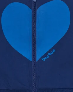 Chaqueta de felpa para niña en azul con corazón en el pecho y cremallera