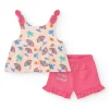 Conjunto crema para niña con blusa de paraguas y shorts rosa con volantes