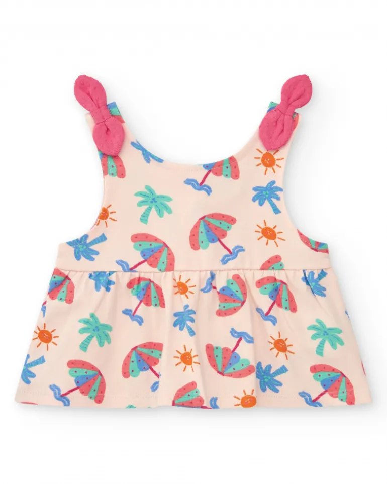 Conjunto crema para niña con blusa de paraguas y shorts rosa con volantes