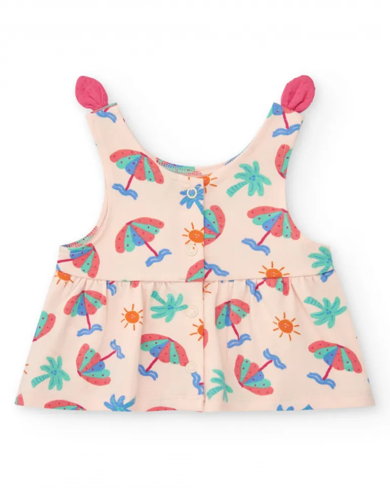 Conjunto crema para niña con blusa de paraguas y shorts rosa con volantes