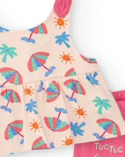 Conjunto crema para niña con blusa de paraguas y shorts rosa con volantes