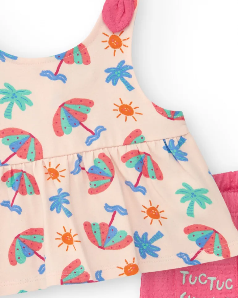 Conjunto crema para niña con blusa de paraguas y shorts rosa con volantes