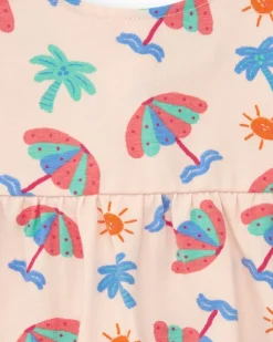 Conjunto crema para niña con blusa de paraguas y shorts rosa con volantes