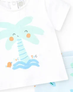 Conjunto de baño para niño con camiseta blanca de palmera y pantalón azul de estampado tropical