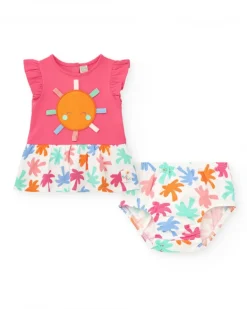Conjunto fucsia para niña con vestido de sol y braguita con estampado tropical