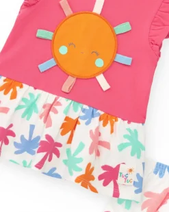 Conjunto fucsia para niña con vestido de sol y braguita con estampado tropical