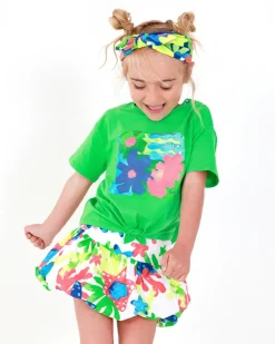 Falda para niña en blanco con estampado tropical multicolor