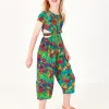 Mono para niña con estampado tropical, botones frontales y aberturas laterales