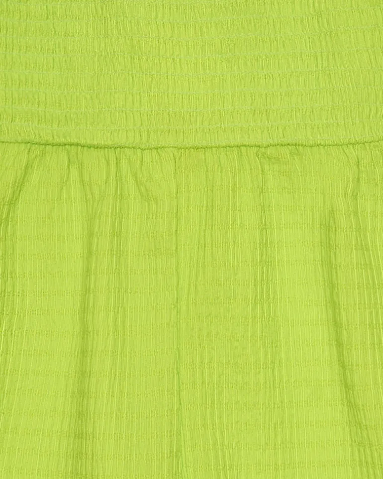 Mono para niña en verde con tirantes y detalles multicolor