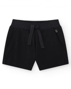 Pantalón corto para niña color negro con cintura elástica y bolsillos