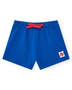 Pantalón corto para niña en azul con cintura elástica y lazo rojo