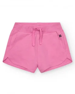 Pantalón corto para niña en rosa fucsia con cintura elástica y bolsillos