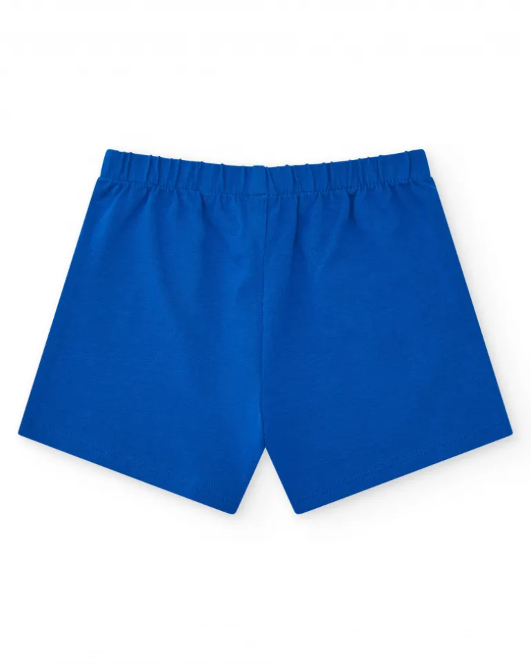 Pantalón corto para niña en azul con cintura elástica y lazo rojo