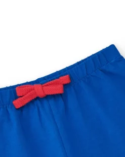 Pantalón corto para niña en azul con cintura elástica y lazo rojo