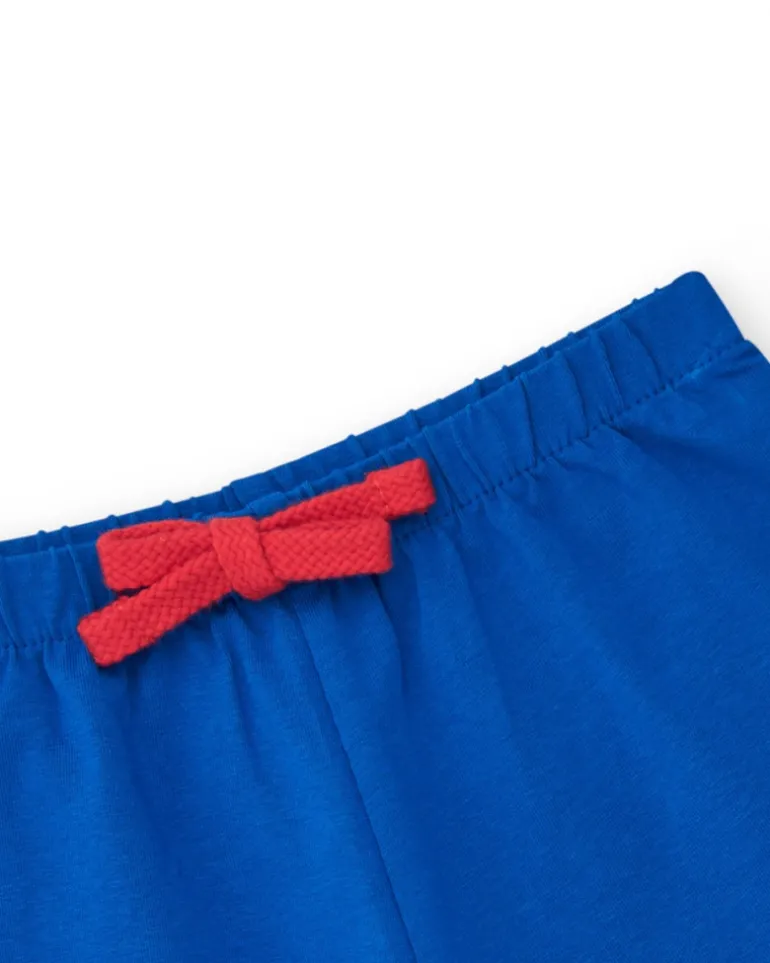 Pantalón corto para niña en azul con cintura elástica y lazo rojo