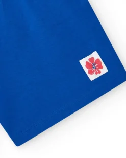 Pantalón corto para niña en azul con cintura elástica y lazo rojo