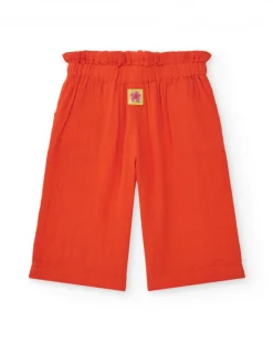 Pantalón culotte naranja para niña con cintura fruncida y lazo