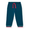 Pantalón de felpa para niño en azul marino con puños a rayas