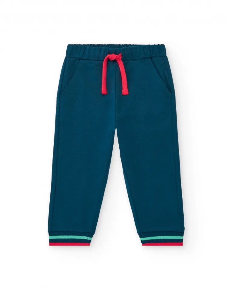 Pantalón de felpa para niño en azul marino con puños a rayas