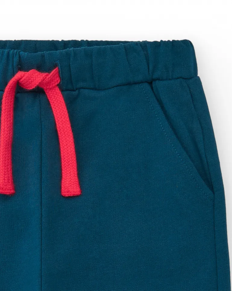 Pantalón de felpa para niño en azul marino con puños a rayas