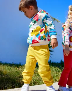 Pantalón felpa niño en amarillo con detalle gráfico divertido Happy Garden