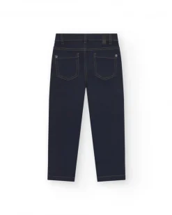 Pantalón para niño en azul marino con bolsillos y pespuntes en contraste.