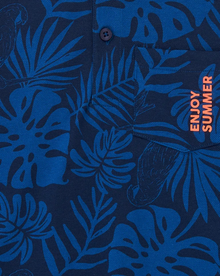 Polo para niño en azul con estampado tropical y bordado