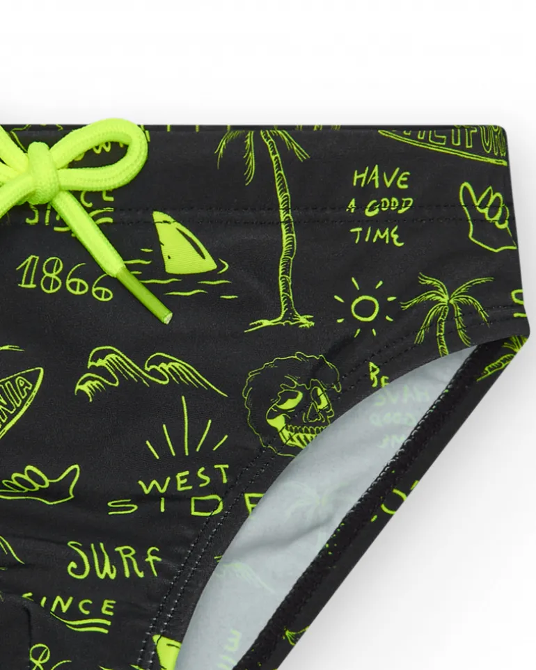 Slip de baño para niño en negro con estampado surfero y cordón flúor.