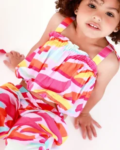 Top rosa para niña con estampado multicolor y lazos en los tirantes