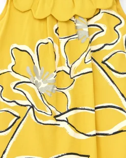 Vestido amarillo sin mangas para niña con estampado floral y cuello volante
