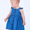 Vestido denim para niña con volantes y botones rojos