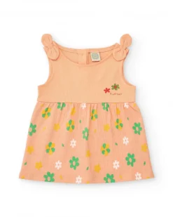 Vestido melocotón para niña con estampado floral y tirantes anudados